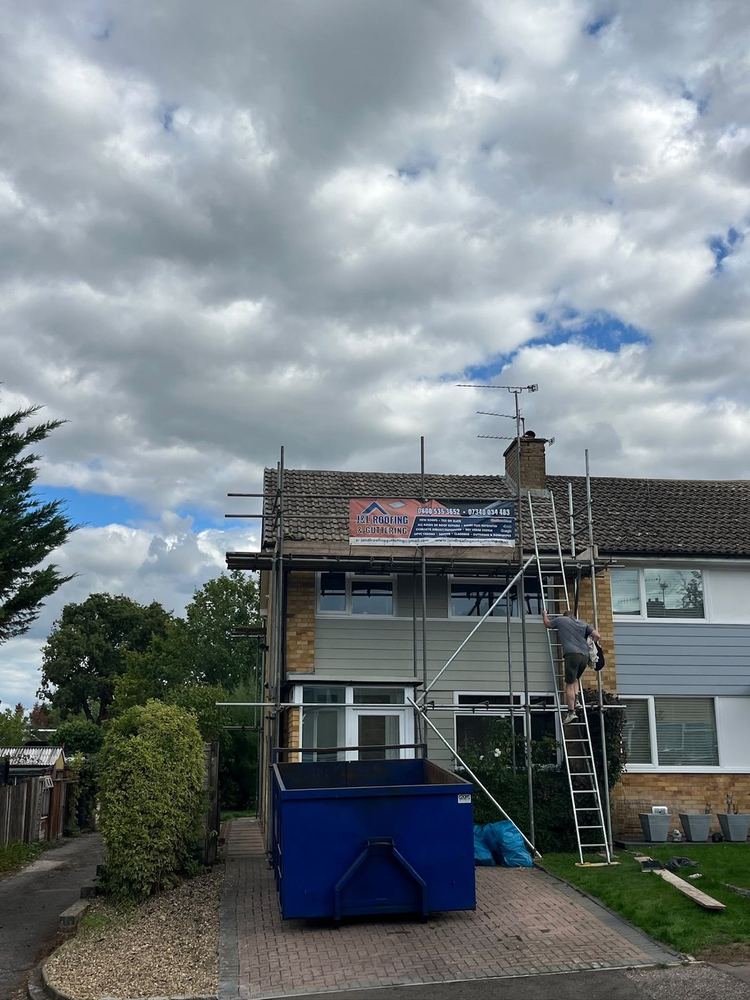 Scaffold up and skip on the drive for a full re-roof in Surrey