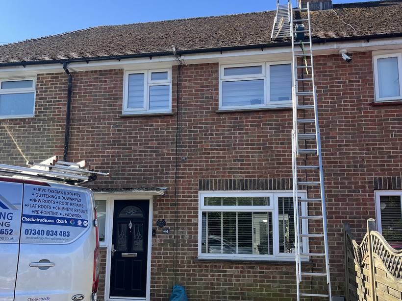Semi detached house with new roof and scaffold