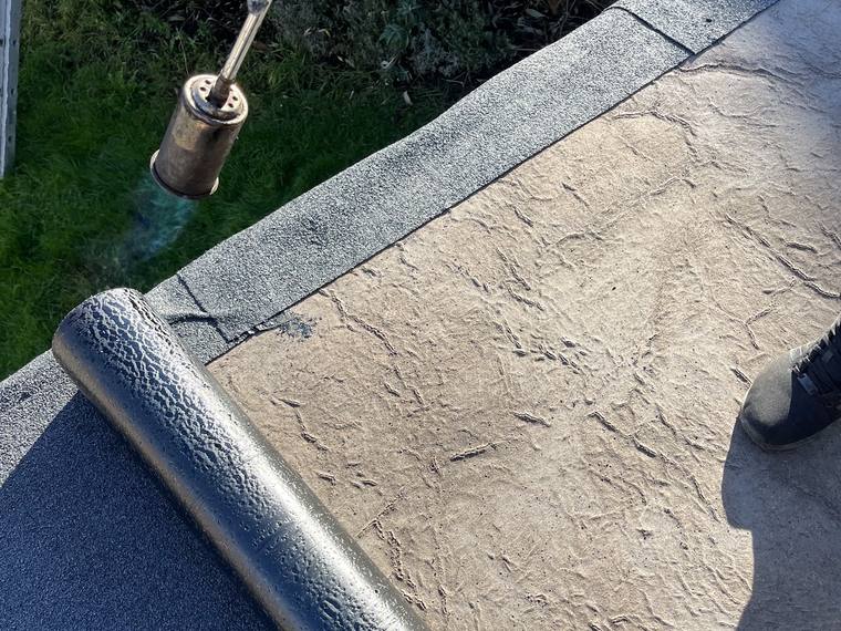 New felt flat roof being laid
